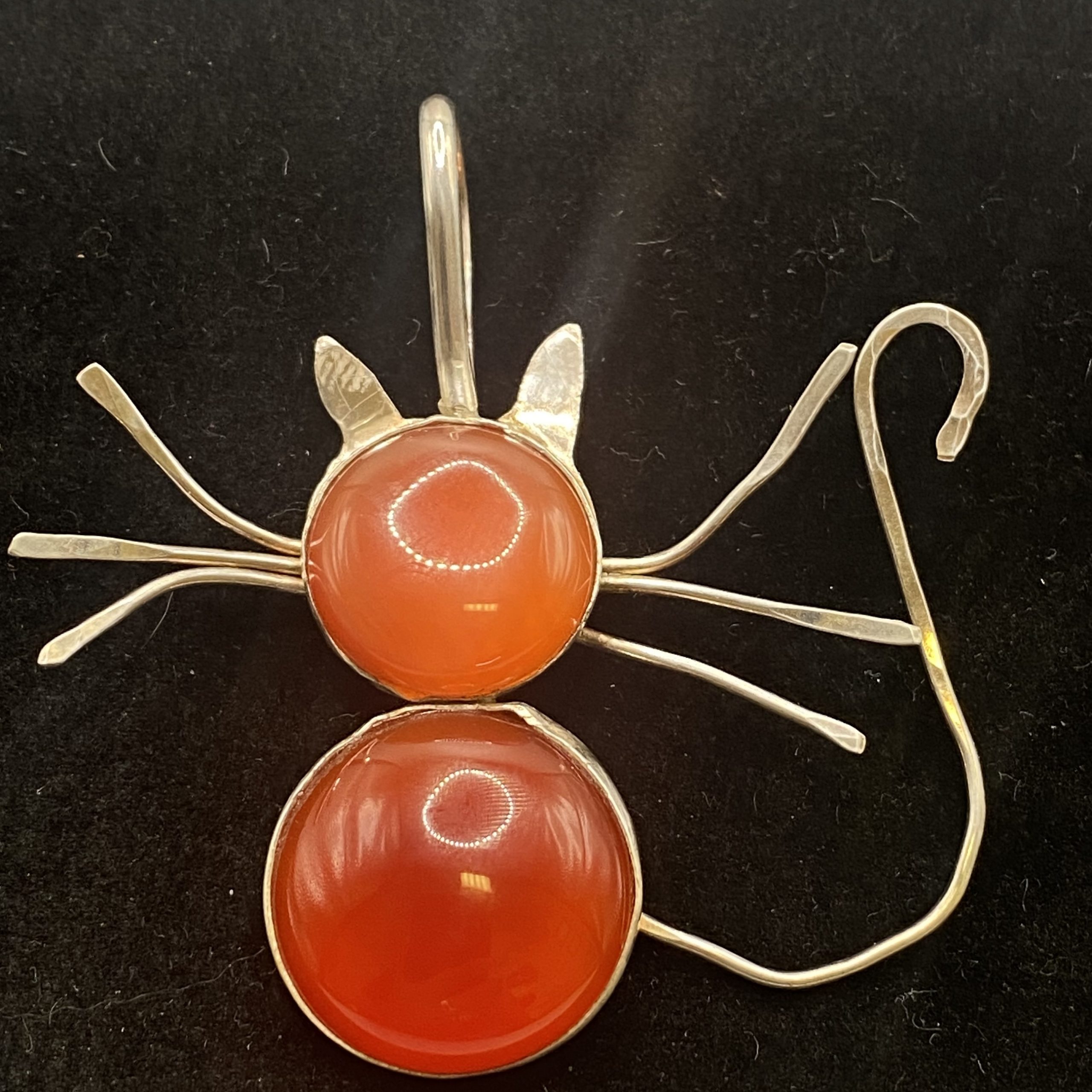 Cat shaped carnelian and silver pendant
