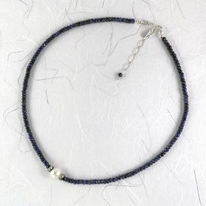 Blue sapphires with a freshwater pearl and crystal necklace view 1