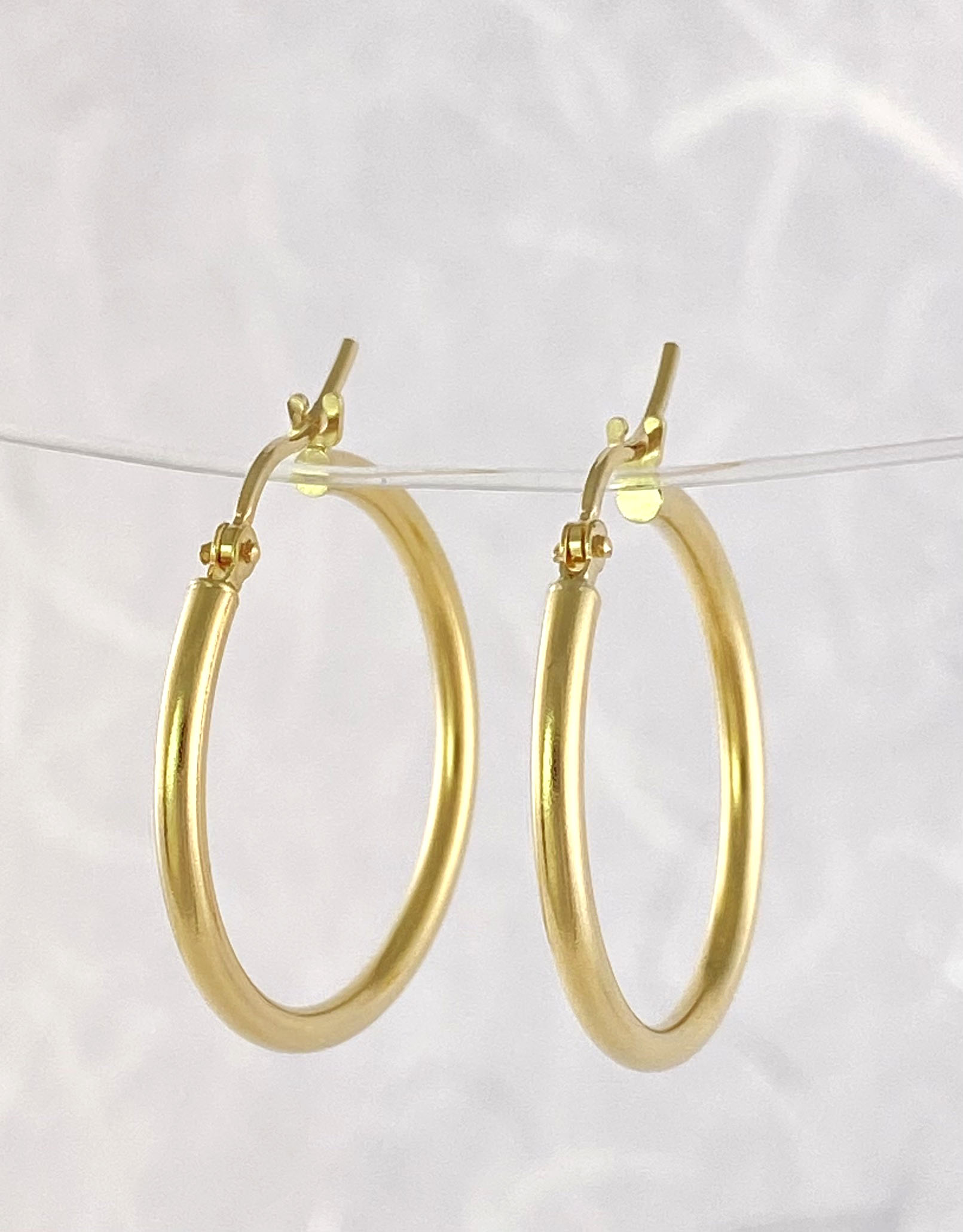 Yellow gold hoop earrings view 2