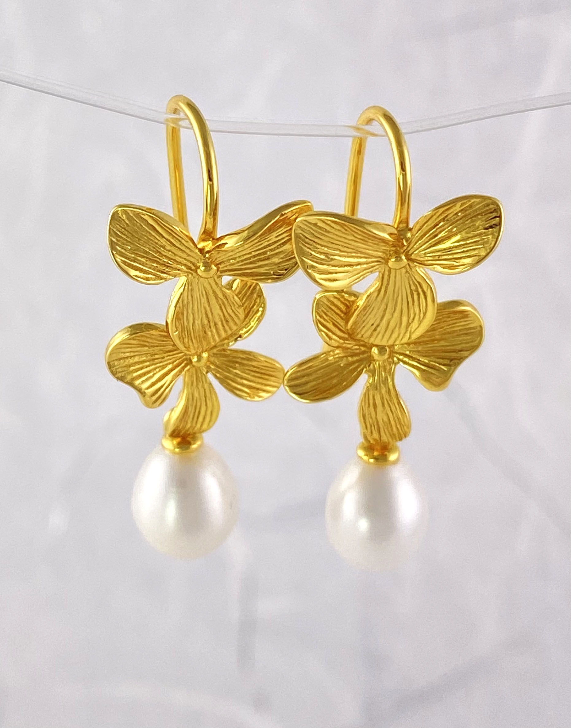 Pearl and Gold layered dogwood bloom shaped earrings view 3