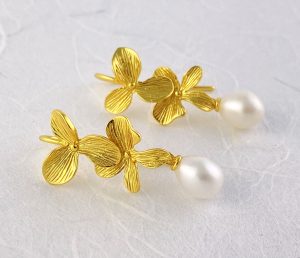 Pearl and Gold layered dogwood bloom shaped earrings view 1