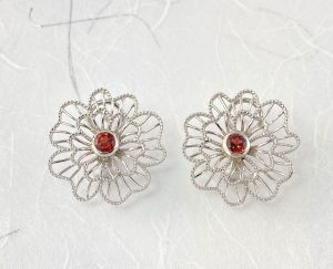 Red garnet center stud with a clip earrings view 2