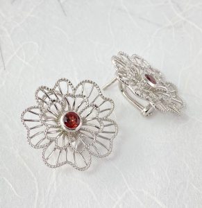 Red garnet center stud with a clip earrings view 1